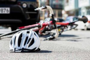 bicycle helmet on the ground, bicycle accident