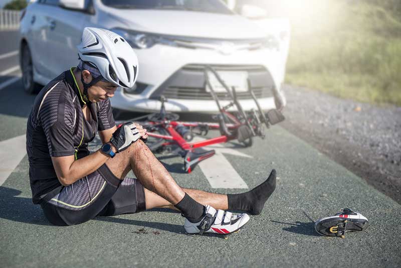 male cyclist hit by a car