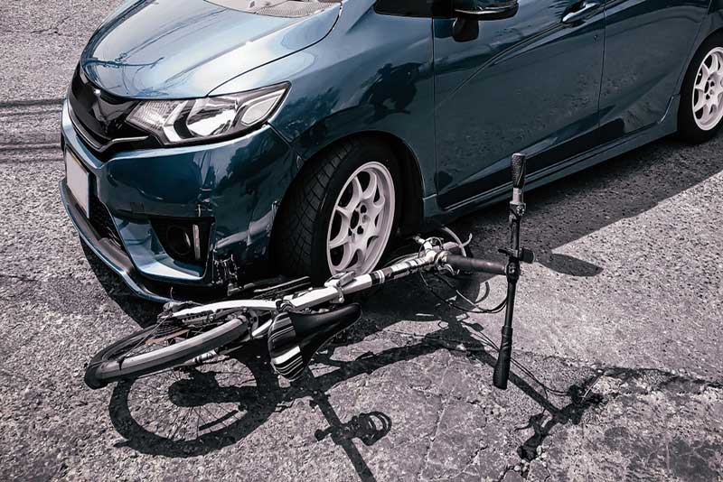 car and bicycle accident on the road