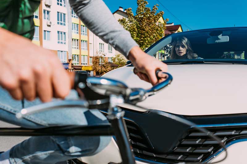 cyclist hit by a white car