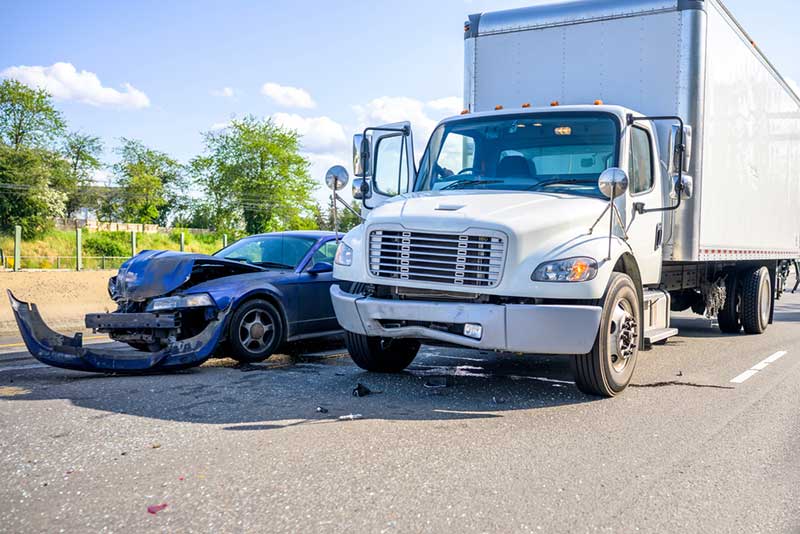 white truck and blue car collision