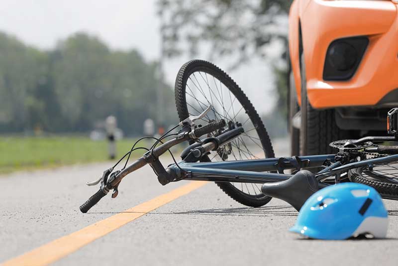 bike and blue helmet on the ground